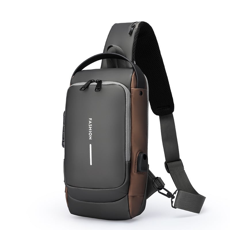 Gray and brown crossbody sling backpack with padded strap and front zippered pocket